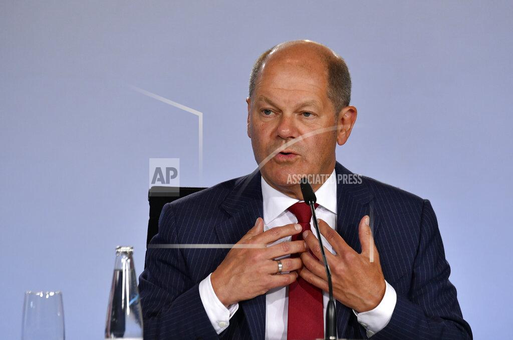 German Finance Minister and Vice-Chancellor Olaf Scholz addresses a press conference at the Chancellery in Berlin, Wednesday June 3, 2020, after coalition meetings. Germany’s governing parties agreed on a 130 billion euro ($146 billion) stimulus package Wednesday meant to help kick-start Europe’s biggest economy, which has taken a heavy hit from the coronavirus pandemic. Following two days of talks in Berlin, Chancellor Angela Merkel said the package was a “bold response” that would boost consumption and investment and ease the strain on families and others. (John MacDougall/Pool via AP)