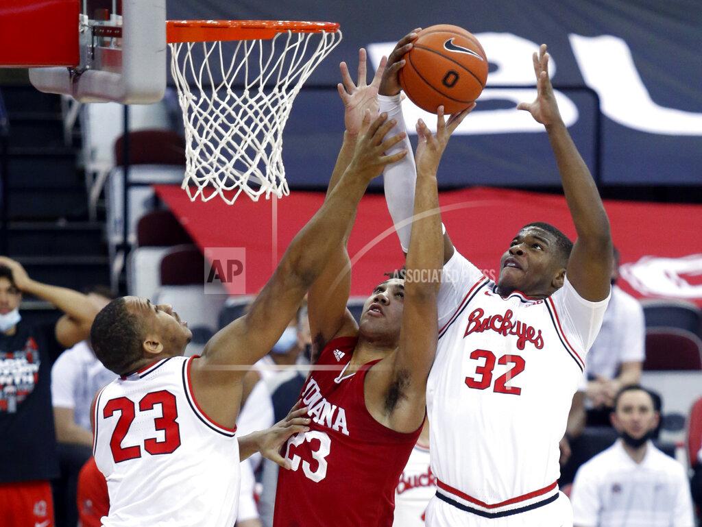 Paul Vernon Indiana forward Trayce Jackson-Davis, center, reaches for a rebound between Ohio State forward Zed Key, left, and forward E.J. Liddell during the first half of an NCAA college basketball game in Columbus, Ohio, Saturday, Feb. 13, 2021. (AP Photo/Paul Vernon)