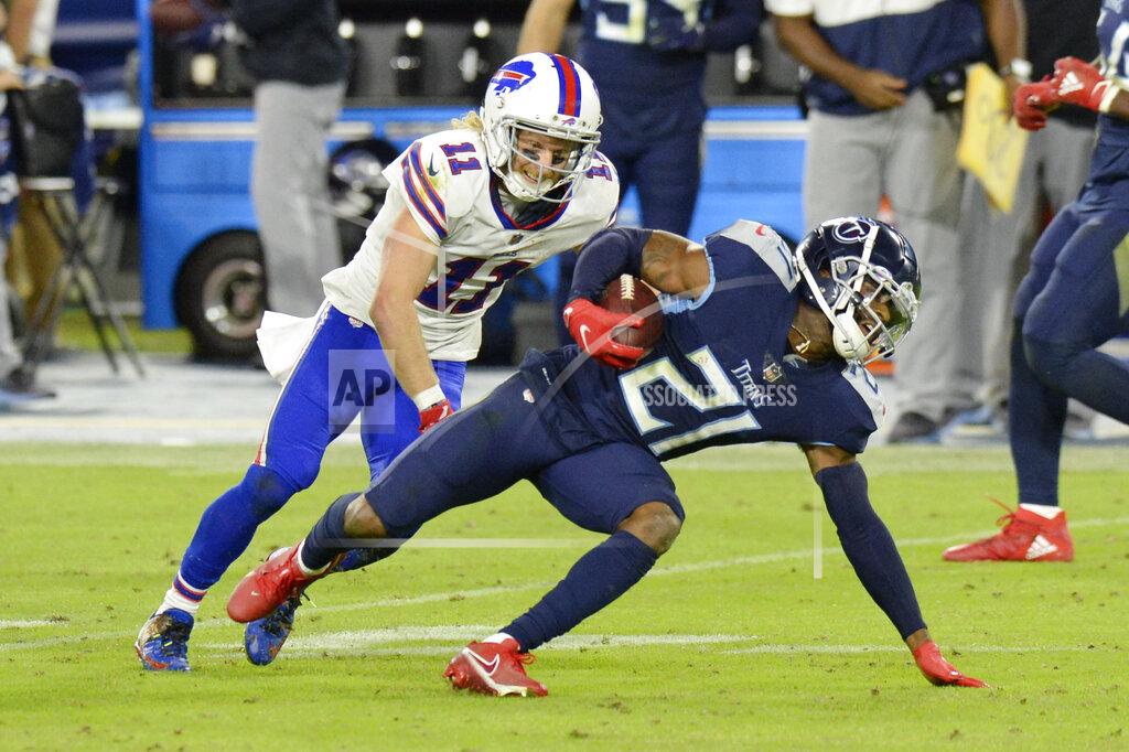Mark Zaleski Tennessee Titans cornerback Malcolm Butler (21) intercepts a pass as Buffalo Bills wide receiver Cole Beasley (11) tries to bring him down in the second half of an NFL football game Tuesday, Oct. 13, 2020, in Nashville, Tenn. (AP Photo/Mark Zaleski)