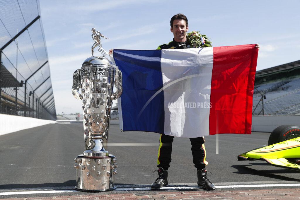 Michael Conroy Simon Pagenaud, of France, winner of the 2019 Indianapolis 500 auto race, poses during the traditional winners photo session at the Indianapolis Motor Speedway in Indianapolis, Monday, May 27, 2019. (AP Photo/Michael Conroy)