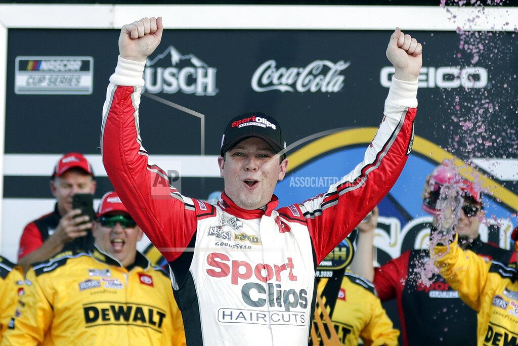 John Raoux Erik Jones celebrates in Victory Lane after winning the NASCAR Busch Clash auto race at Daytona International Speedway, Sunday, Feb. 9, 2020, in Daytona Beach, Fla. (AP Photo/John Raoux)