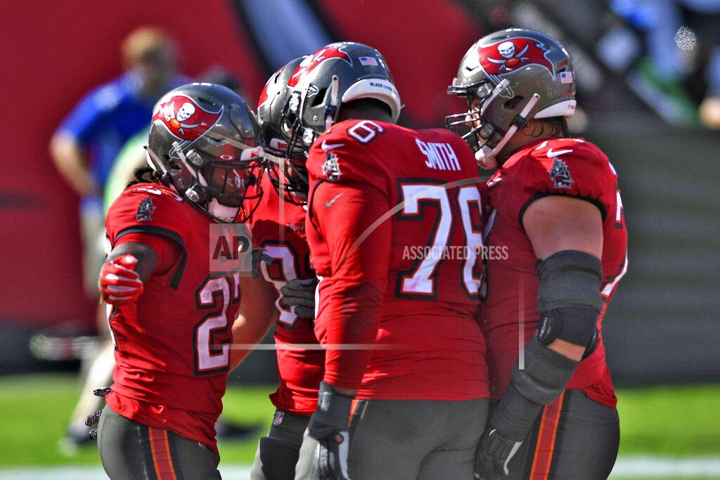 Jason Behnken Tampa Bay Buccaneers running back Ronald Jones II (27) celebrates his score against the Minnesota Vikings with teammates, including offensive tackle Donovan Smith (76) during the first half of an NFL football game Sunday, Dec. 13, 2020, in Tampa, Fla. (AP Photo/Jason Behnken)