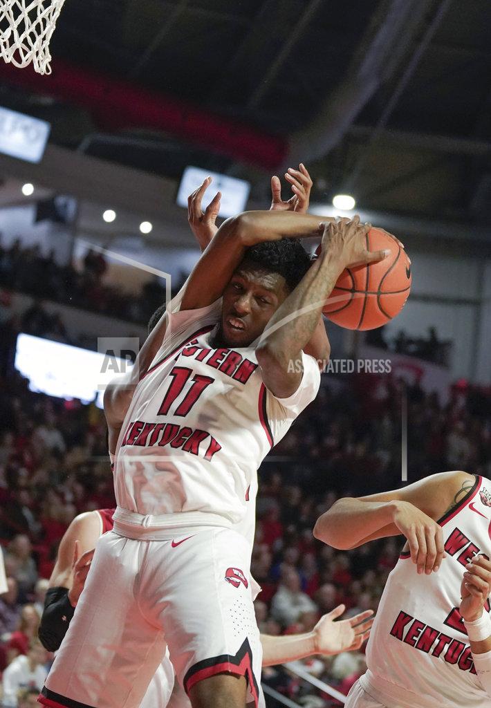 Tim Broekema Western Kentucky guard Taveion Hollingsworth (11) and center Charles Bassey (23) pull down a defensive rebound during the second half of an NCAA college basketball game against Wisconsin, Saturday, Dec. 29, 2018, in Bowling Green, Ky. (AP Photo/Tim Broekema)
