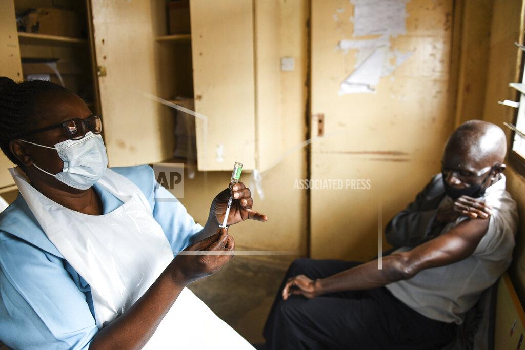 Thoko Chikondi A man prepares for his AstraZeneca COVID-19 vaccine at Ndirande Health Centre in Blantyre Malawi, Monday, March 29, 2021. Malawi is vaccinating health care workers, elderly and those with health conditions that put them at higher risk of severe COVID-19, using the AstraZeneca doses that arrived early in March. (AP Photo/Thoko Chikondi)