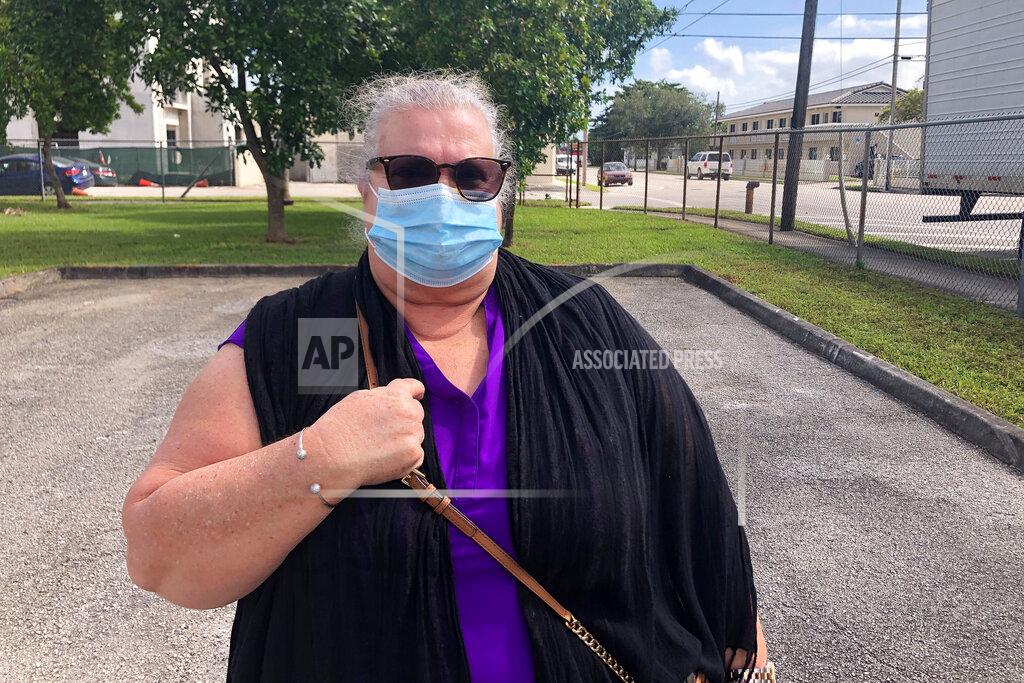 Adriana Gomez Licon Luisa Cabrera speaks about casting her ballot for President Trump Tuesday, Nov. 3, 2020 in in the Miami suburb of Hialeah, Fla. "He is direct. He is a straight shooter," Cabrera said. "He has done a good job with the economy." (AP Photo/Adriana Gomez Licon)