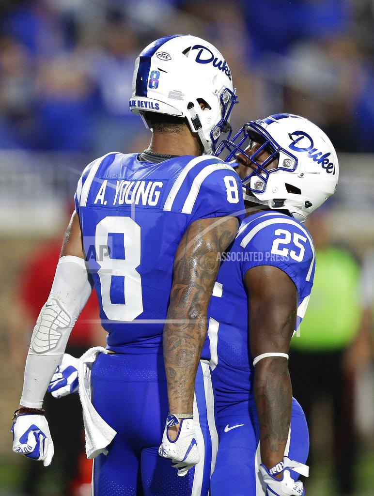 Gerry Broome Duke's Aaron Young (8) and Deon Jackson (25) celebrate following Young's reception against Army during the first half of an NCAA college football game in Durham, N.C., Friday, Aug. 31, 2018. (AP Photo/Gerry Broome)