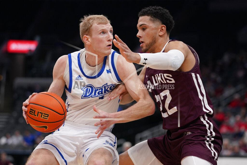 Jeff Roberson Drake's Garrett Sturtz, left, heads to the basket as Southern Illinois' Steven Verplancken Jr. (22) defends during the first half of an NCAA college basketball game in the quarterfinal round of the Missouri Valley Conference tournament Friday, March 4, 2022, in St. Louis. (AP Photo/Jeff Roberson)