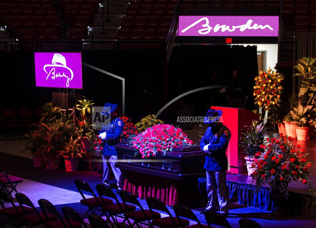 Mark Wallheiser Florida Highway Patrol officers watch over longtime Florida State University football coach Bobby Bowden as he lies in repose at the Tucker Civic Center during a public celebration of life, Saturday, Aug. 14, 2021, in Tallahassee, Fla. Bowden became the FSU football coach in 1976, transforming the program into one of the best in the country. He coached FSU to national championships in 1993 and 1999. Bowden was 91. (AP Photo/Mark Wallheiser)