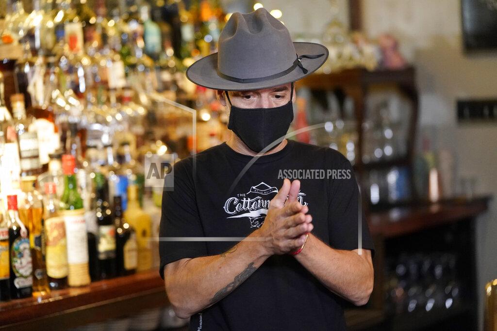 David J. Phillip Michael Neff, co-owner of the Cottonmouth Club, talks about his bar Tuesday, June 23, 2020, in Houston. Neff closed his downtown bar because of concerns within the industry as the number COVID-19 case continues to rise in Houston. (AP Photo/David J. Phillip)