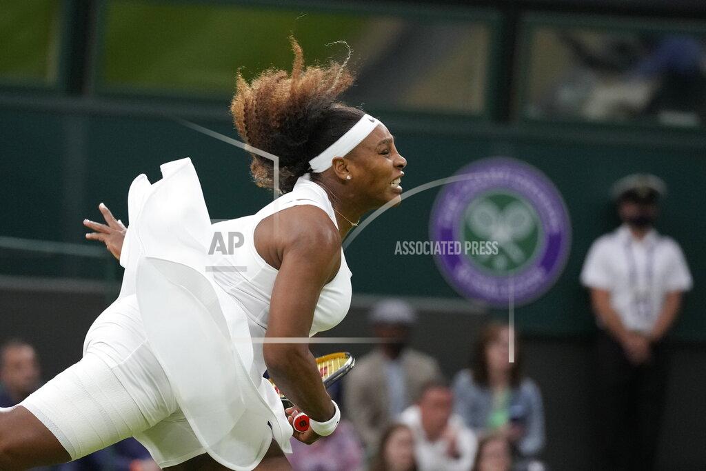 Kirsty Wigglesworth FILE - Serena Williams serves to Aliaksandra Sasnovich of Belarus during the women's singles first round match on day two of the Wimbledon Tennis Championships in London, Tuesday June 29, 2021. Serena Williams plans to make her return to singles competition via a wild-card entry at Wimbledon. (AP Photo/Kirsty Wigglesworth, File)