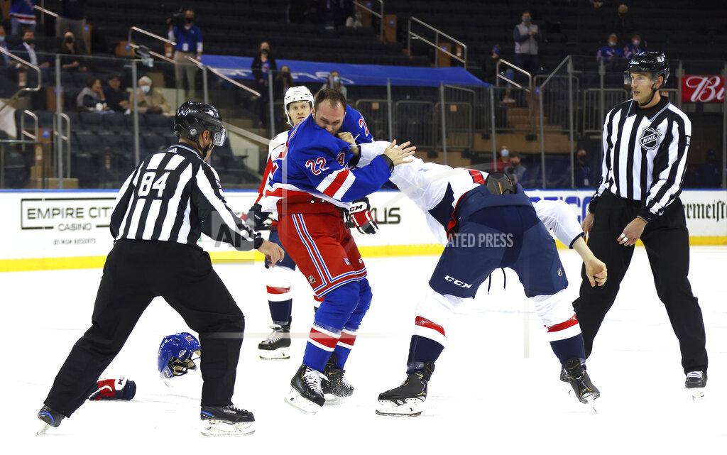 Bruce Bennett New York Rangers' Anthony Bitetto (22) and Washington Capitals' Michael Raffl (17) fight during the first period of an NHL hockey game Wednesday, May 5, 2021, in New York. (Bruce Bennett/Pool Photo via AP)