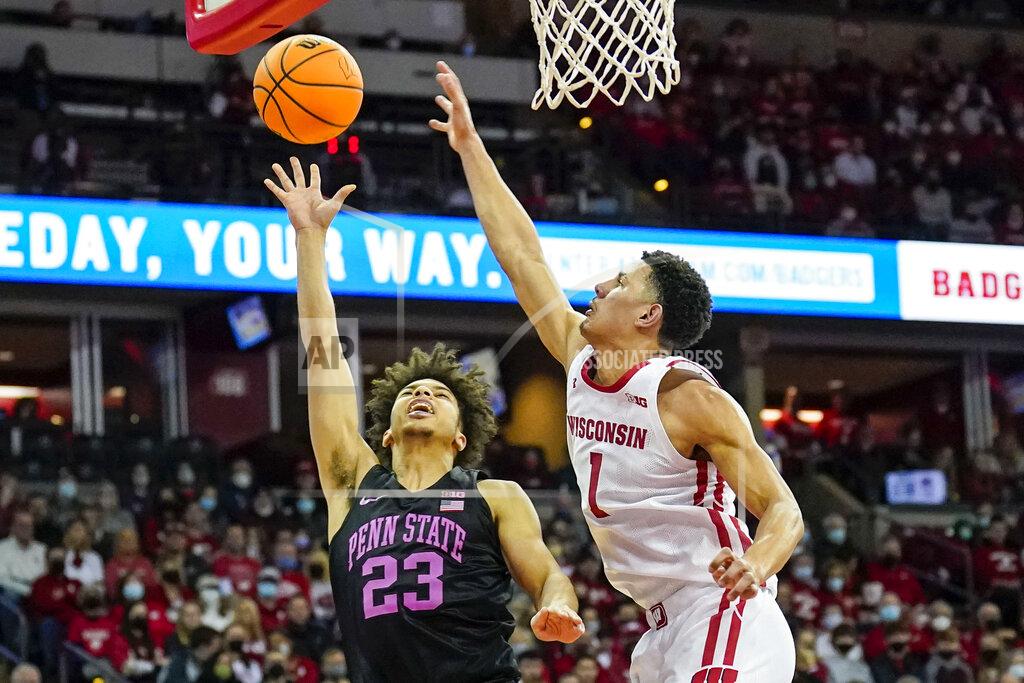Andy Manis Penn State's Dallion Johnson (23) shoots against Wisconsin's Johnny Davis (1) during the first half of an NCAA college basketball game Saturday, Feb. 5, 2022, in Madison, Wis. (AP Photo/Andy Manis)