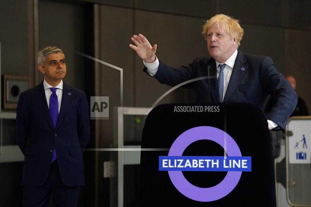 Andrew Matthews Britain's Prime Minister Boris Johnson gives a speech at Paddington Station in London, as Mayor of London Sadiq Khan looks on, to mark the completion of London's Crossrail project, Tuesday May 17, 2022. (Andrew Matthews/Pool via AP)