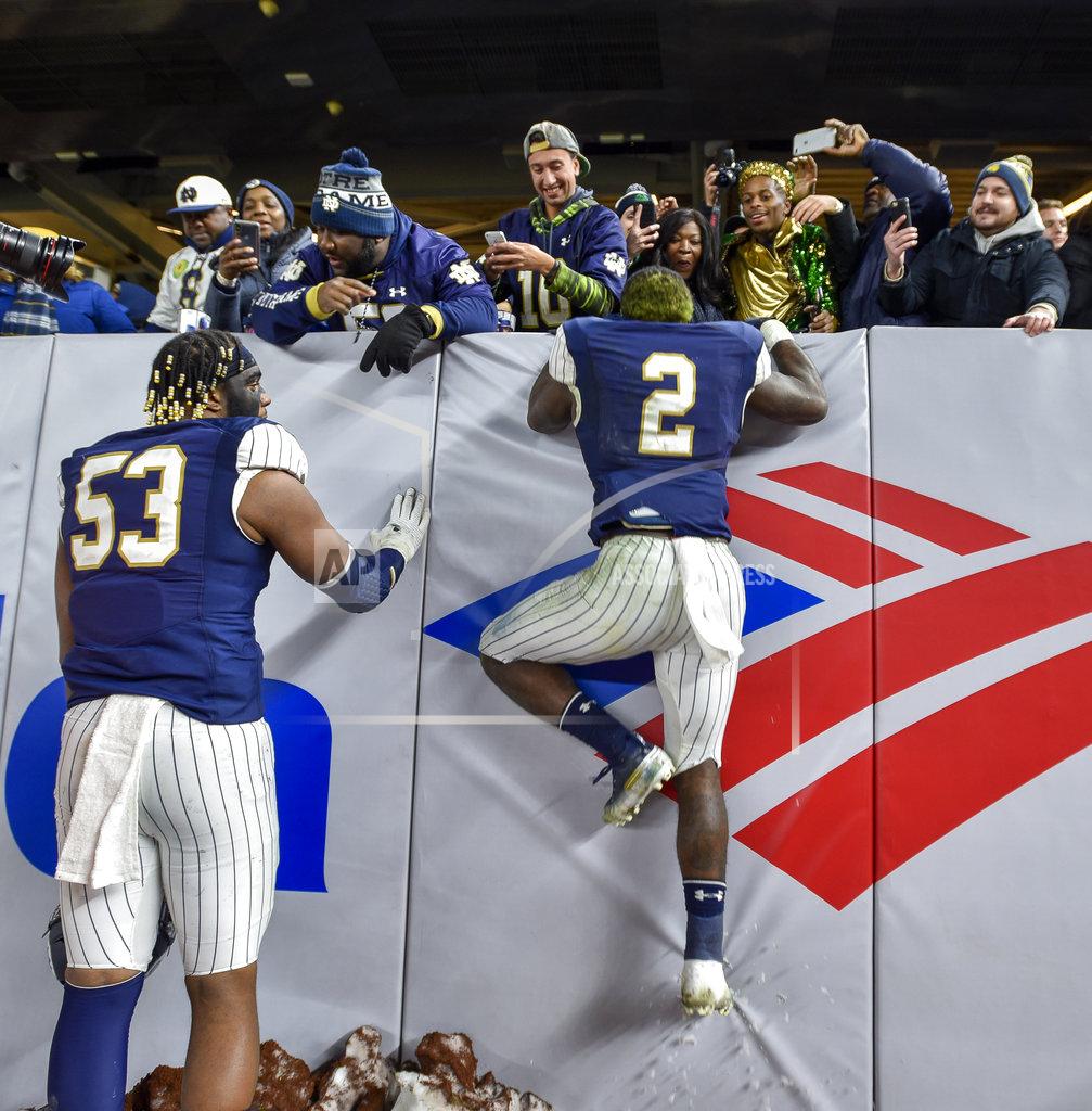 Howard Simmons Notre Dame running back Dexter Williams (2) greets family and friends after an NCAA college football game against Syracuse, Saturday, Nov. 17, 2018, at Yankee Stadium in New York. (AP Photo/Howard Simmons)