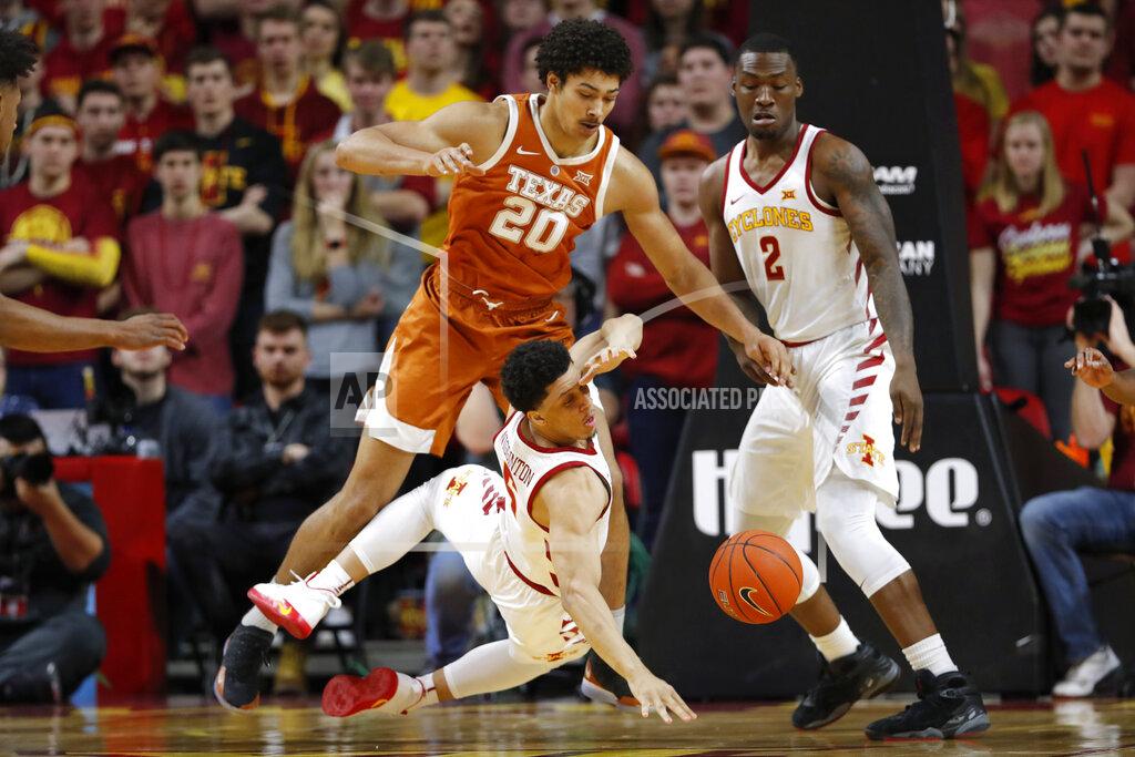 Charlie Neibergall Iowa State guard Lindell Wigginton loses the ball while driving past Texas forward Jericho Sims (20) during the first half of an NCAA college basketball game, Saturday, Feb. 2, 2019, in Ames, Iowa. Iowa State forward Cameron Lard, right, looks on. (AP Photo/Charlie Neibergall)