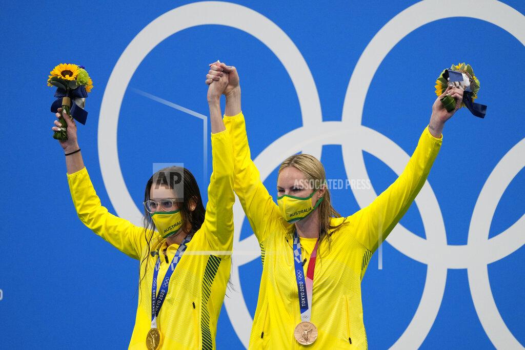 Jae C. Hong Kaylee Mckeown, of Australia, left, poses with teammate Emily Seebohm after winning the gold medal in the women's 200-meter backstroke final at the 2020 Summer Olympics, Saturday, July 31, 2021, in Tokyo, Japan. Seebohm won the bronze medal. (AP Photo/Jae C. Hong)