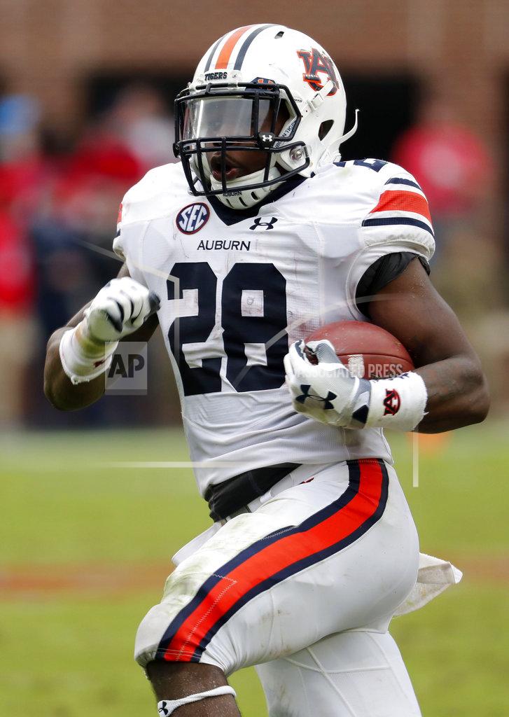 Rogelio V. Solis Auburn running back JaTarvious Whitlow (28) runs for a short gain against Mississippi during the first half of an NCAA college football game on Saturday, Oct. 20, 2018, in Oxford, Miss. Auburn won 31-16. (AP Photo/Rogelio V. Solis)