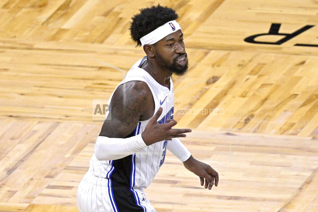 Phelan M. Ebenhack Orlando Magic guard Terrence Ross celebrates after scoring a 3-point basket during the second half of the team's NBA basketball game against the New York Knicks, Wednesday, Feb. 17, 2021, in Orlando, Fla. (AP Photo/Phelan M. Ebenhack)