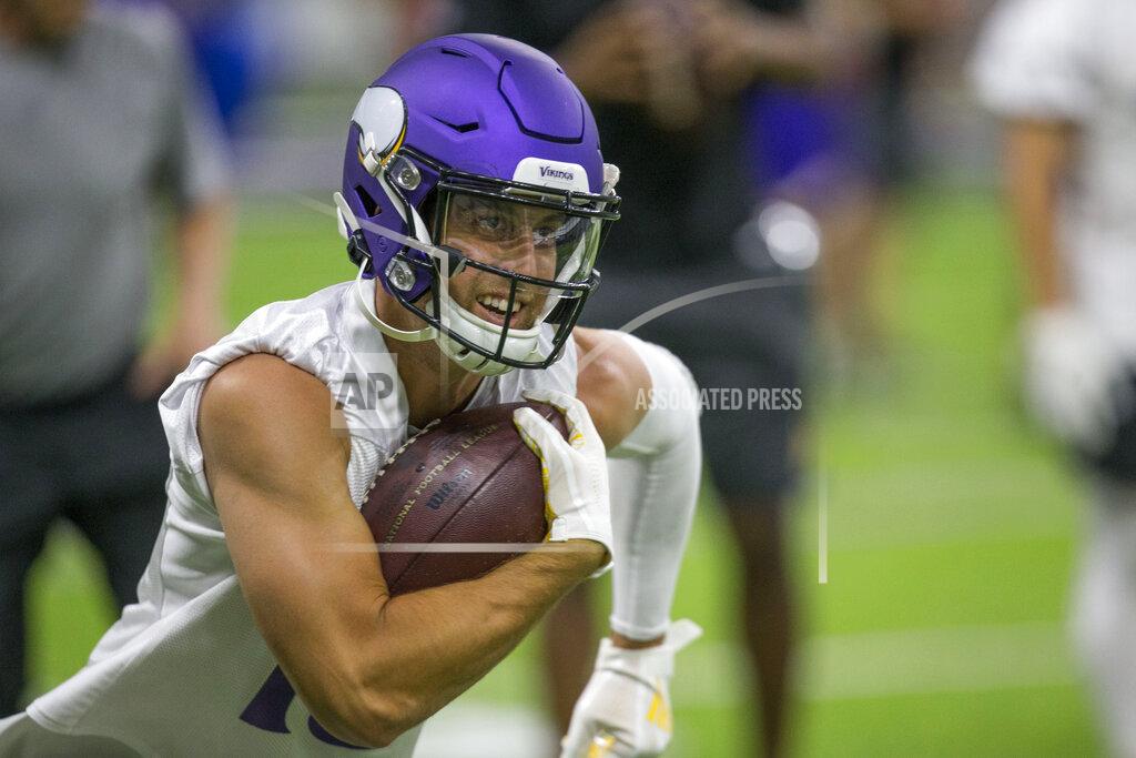 Andy Clayton-King Minnesota Vikings wide receiver Adam Thielen runs after a catch during drills at the team's NFL football training facility in Eagan, Minn. Tuesday, June 11, 2019. (AP Photo/Andy Clayton- King)