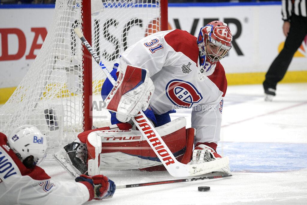 Phelan Ebenhack FILE - In this Wednesday, July 7, 2021 file photo, Montreal Canadiens goaltender Carey Price (31) plays the puck during the first period in Game 5 of the NHL hockey Stanley Cup finals against the Tampa Bay Lightning, in Tampa, Fla. After backstopping the Montreal Canadiens to the Stanley Cup Final, Price has been left unprotected for the Seattle Kraken expansion draft. Price agreed to be exposed so the Canadiens could protect cheaper backup Jake Allen. The league released the protected lists of all 30 teams eligible for the expansion draft Sunday morning, July 18. (AP Photo/Phelan Ebenhack, File)