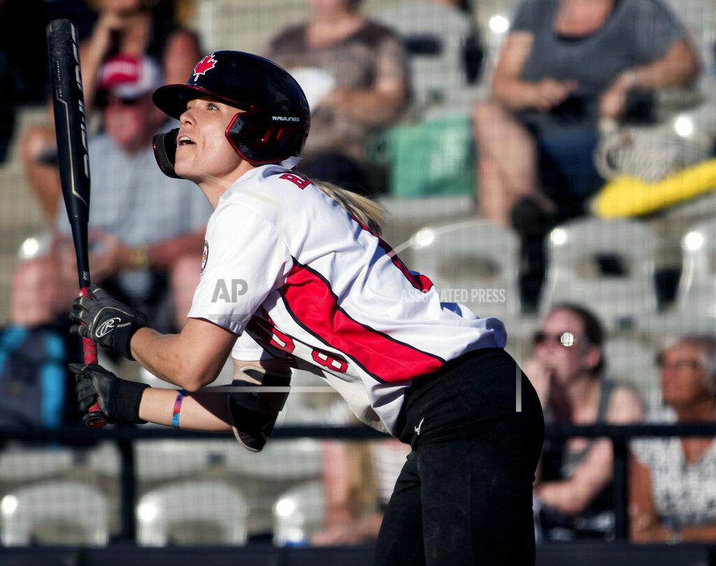 FILE - In this Aug. 27, 2019, file photo, Canada's Victoria Hayward watches her inside-the-park grand slam against Guatemala during the first inning of a game in the Softball Americas Olympic qualifier tournament in Surrey, British Columbia. Hayward would have been in Japan right about now preparing for the Olympics as captain of Canada's softball team. The coronavirus pandemic pushed the Summer Games back a year. But she will not have to wait too much longer to get back on the field. She is one of the 56 elite players signed to suit up when Athletes Unlimited launches the first of its professional women's sports leagues with a six-week season near Chicago in late August and an innovative model made for the moment. (Darryl Dyck/The Canadian Press via AP, File)