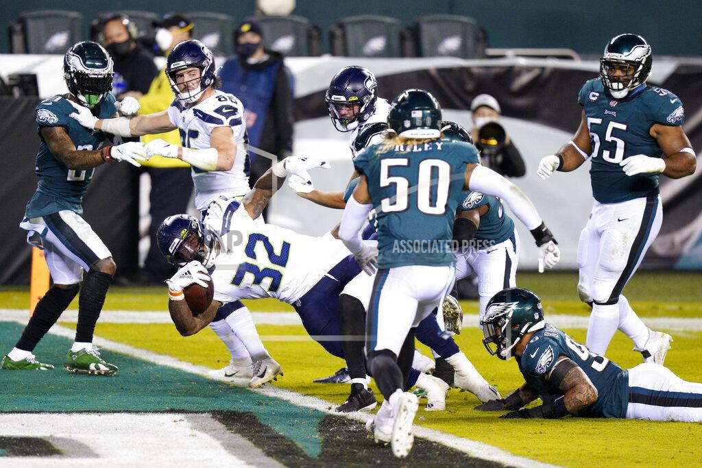 Chris Szagola Seattle Seahawks' Chris Carson (32) scores a touchdown during the first half of an NFL football game against the Philadelphia Eagles, Monday, Nov. 30, 2020, in Philadelphia. (AP Photo/Chris Szagola)