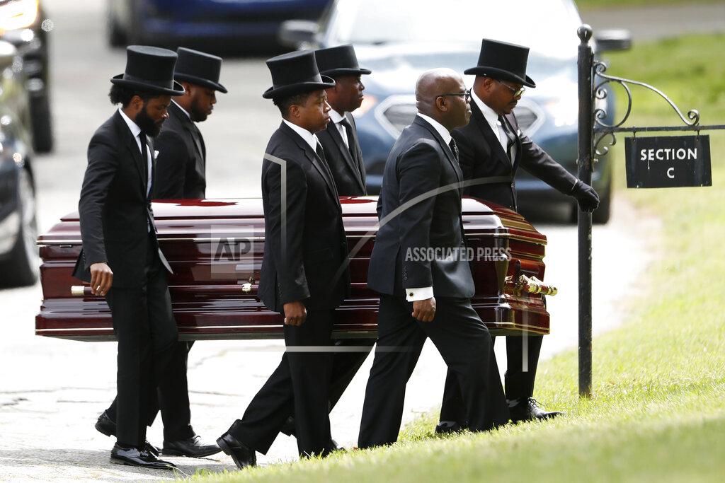 John Bazemore FILE - In this Saturday, April 4, 2020 file photo, pallbearers carry the casket of The Rev. Joseph E. Lowery at the Westview cemetery in Atlanta. Lowery, 98, a veteran civil rights leader, helped the Rev. Martin Luther King Jr. found the Southern Christian Leadership Conference and fought against racial discrimination. Lowery led the SCLC for two decades and received the Presidential Medal of Freedom during the Obama presidency. (AP Photo/John Bazemore, Pool)