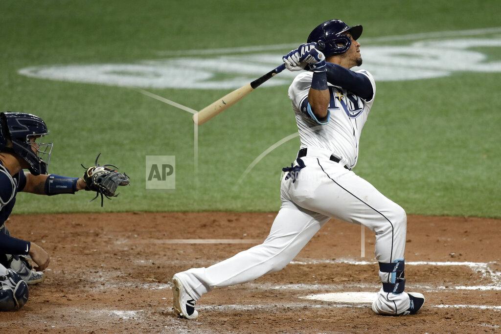 Chris O'meara Tampa Bay Rays' Michael Perez watches his run scoring sacrifice fly off New York Yankees relief pitcher Adam Ottavino during the eighth inning of a baseball game Friday, Aug. 7, 2020, in St. Petersburg, Fla. Rays' Yoshi Tsutsugo scored. Catching for the Yankees is Gary Sanchez. (AP Photo/Chris O'Meara)