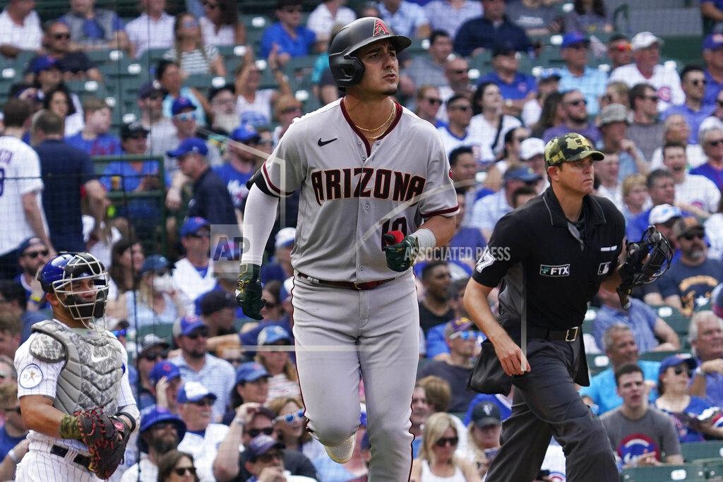 Nam Y. Huh Arizona Diamondbacks' Josh Rojas watches his solo home run during the seventh inning of a baseball game against the Chicago Cubs in Chicago, Friday, May 20, 2022. (AP Photo/Nam Y. Huh)