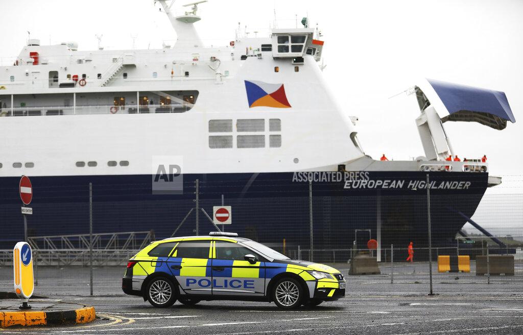 Peter Morrison Police patrol the port of Larne, Northern Ireland, Tuesday, Feb. 2, 2021. Authorities in Northern Ireland have suspended checks on animal products and withdrawn workers from two ports after threats against border staff. (AP Photo/Peter Morrison)