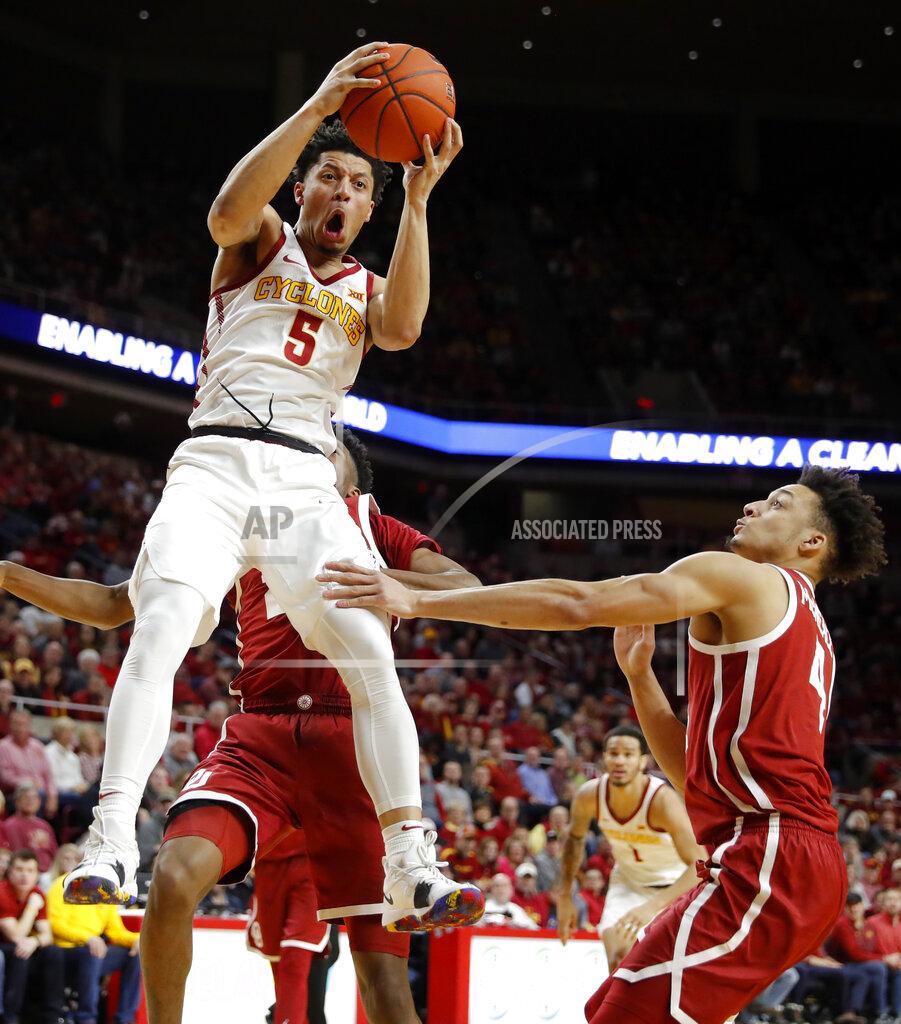 Charlie Neibergall Iowa State guard Lindell Wigginton (5) grabs a rebound over Oklahoma center Jamuni McNeace, right, during the second half of an NCAA college basketball game, Monday, Feb. 25, 2019, in Ames, Iowa. (AP Photo/Charlie Neibergall)