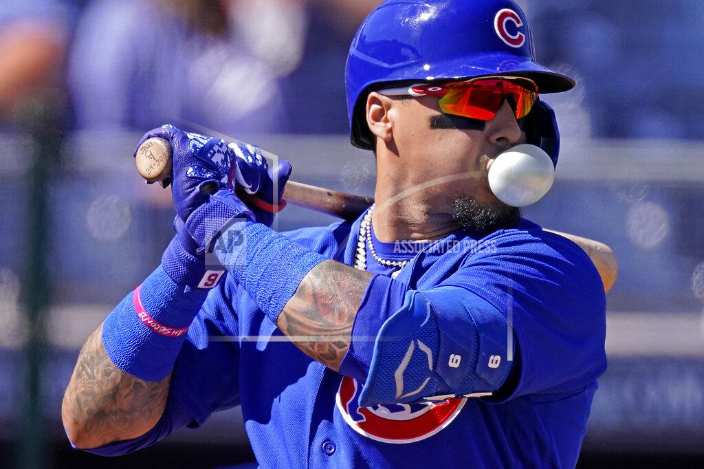 Charlie Riedel Chicago Cubs' Javier Baez blows a bubble as he waits for a pitch during the first inning of a spring training baseball game against the San Diego Padres, Monday, March 1, 2021, in Peoria, Ariz. (AP Photo/Charlie Riedel)