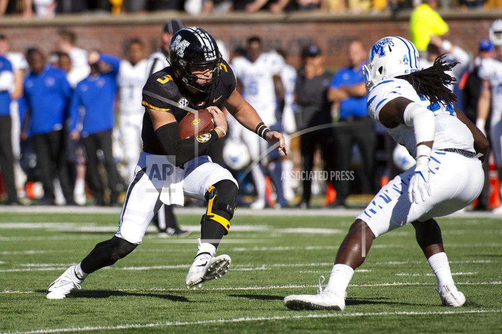 L.g. Patterson Missouri quarterback Drew Lock runs the ball as Memphis' JJ Russell, right, prepares to tackle him during the first half of an NCAA college football game, Saturday, Oct. 20, 2018, in Columbia, Mo. Missouri won the game 65-33. (AP Photo/L.G. Patterson)