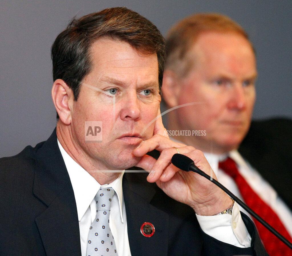 Phil Skinner Georgia Secretary of State Brian Kemp, left, and State Election Board member L. Kent Webb listen as investigators grill Fulton County elections officials on problems with last years presidential elections during a hearing at the Sloppy Floyd building in Atlanta on Thursday, Jan. 31, 2013. A statewide spotlight will be cast on Fulton County's incompetence Thursday when the State Election Board holds a hearing, somewhere at the state Capitol complex, on recent elections problems. Secretary of State Brian Kemp fast-tracked investigations into more than 100 complaints about Fulton's polling problems during last year's presidential contest. The election board, which he chairs, will decide whether to reprimand the county or send cases on to the state Attorney General for possible prosecution. (Phil Skinner/Atlanta Journal-Constitution via AP)