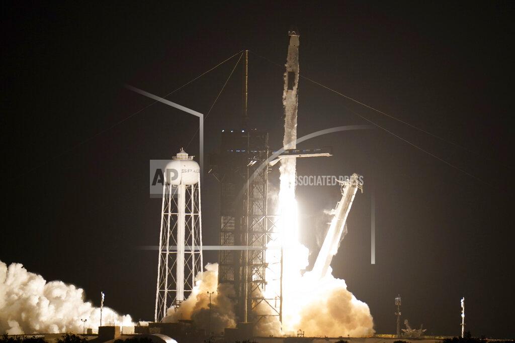 John Raoux A SpaceX Falcon 9 rocket with the Crew Dragon space capsule lifts off from pad 39A at the Kennedy Space Center in Cape Canaveral, Fla., Friday, April 23, 2021. (AP Photo/John Raoux)