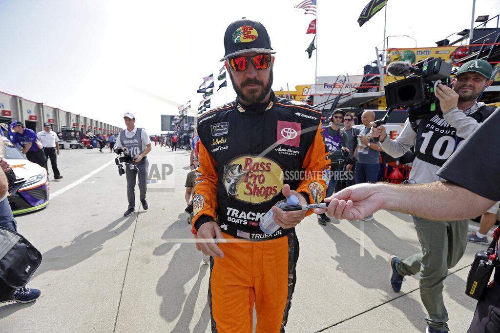 Gerry Broome Martin Truex Jr. signs autographs for fans during practice prior to Sunday's NASCAR Cup Series auto race at Charlotte Motor Speedway in Concord, N.C., Saturday, Sept. 28, 2019. (AP Photo/Gerry Broome)