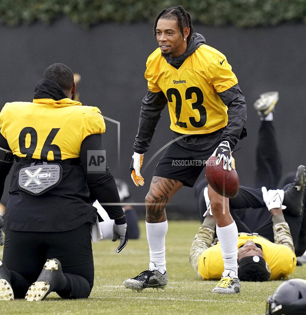 Matt Freed Pittsburgh Steelers cornerback Joe Haden (23) talks with defensive end Isaiah Buggs (96) during NFL football practice, Wednesday, Dec. 15, 2021, at UPMC Rooney Sports Complex in Pittsburgh. (Matt Freed/Pittsburgh Post-Gazette via AP)