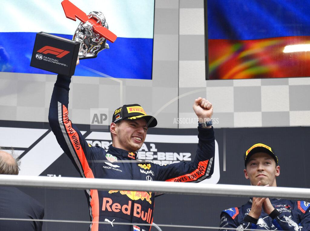 Jens Meyer Red Bull driver Max Verstappen of the Netherland's celebrates on the podium after he won the German Formula One Grand Prix at the Hockenheimring racetrack in Hockenheim, Germany, Sunday, July 28, 2019. (AP Photo/Jens Meyer)