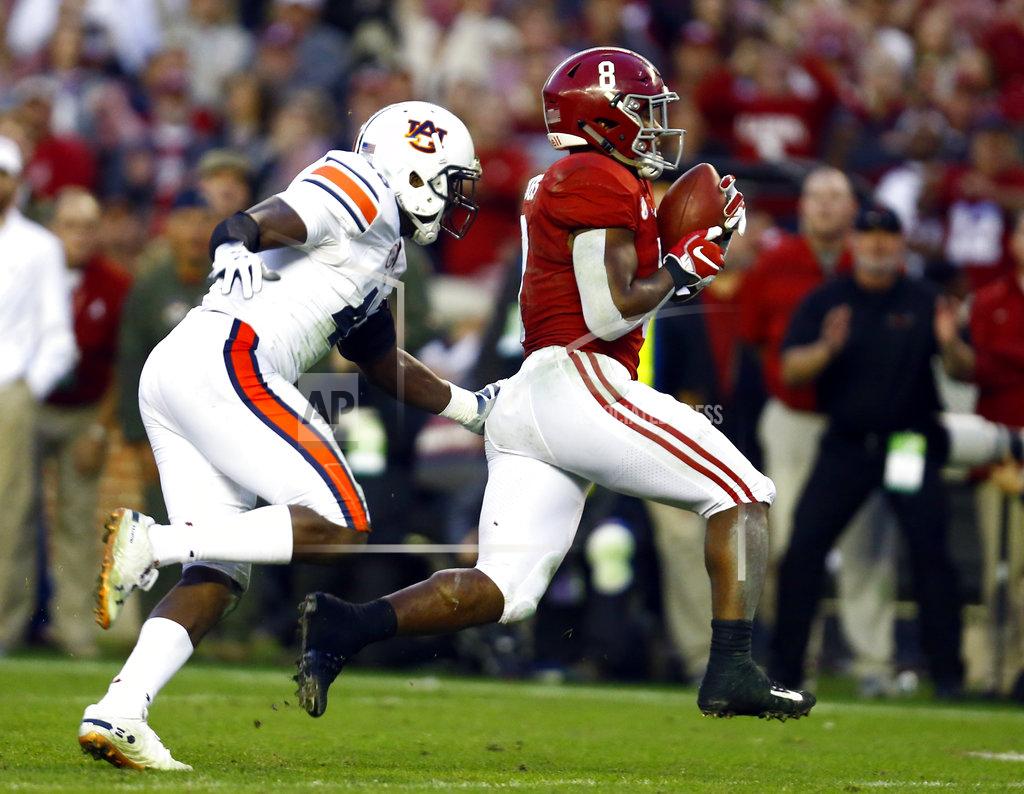 Butch Dill Alabama running back Josh Jacobs (8) catches a pass and carries it in for a touchdown as Auburn linebacker Darrell Williams (49) tries to defend during the second half of an NCAA college football game, Saturday, Nov. 24, 2018, in Tuscaloosa, Ala. (AP Photo/Butch Dill)