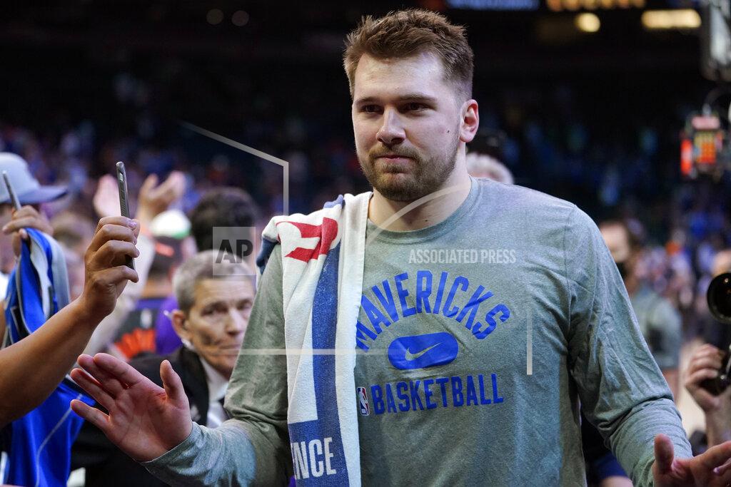 Matt York Dallas Mavericks guard Luka Doncic (77) leaves the court after Game 7 of an NBA basketball Western Conference playoff semifinal against the Phoenix Suns, Sunday, May 15, 2022, in Phoenix. The Mavericks defeated the Suns 123-90. (AP Photo/Matt York)