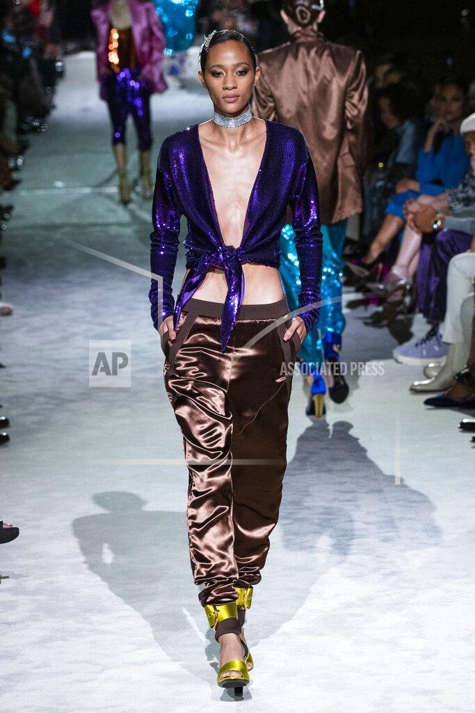 Eduardo Munoz Alvarez A model walks the runway at the Tom Ford spring/summer 2022 fashion show at Lincoln Center during New York Fashion Week on Sunday, Sept. 12, 2021. (AP Photo/Eduardo Munoz Alvarez)