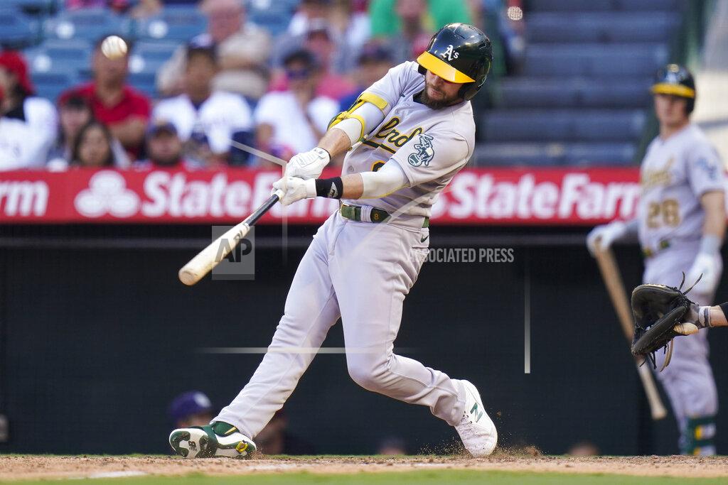 Jae C. Hong Oakland Athletics' Jed Lowrie hits a sacrifice fly to bring in Matt Olson to score during the 10th inning of a baseball game against the Los Angeles Angels, Sunday, Sept. 19, 2021, in Anaheim, Calif. (AP Photo/Jae C. Hong)