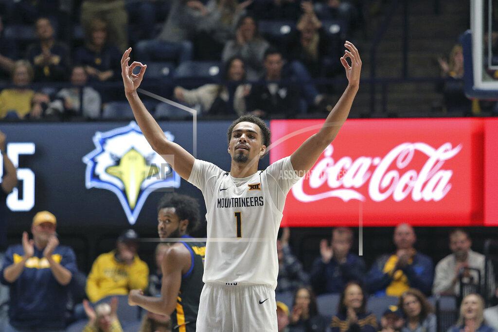 Kathleen Batten West Virginia forward Emmitt Matthews Jr. (1) reacts after a score against Morehead State during the second half of an NCAA college basketball game in Morgantown, W.Va., Tuesday, Nov. 15, 2022. (AP Photo/Kathleen Batten)