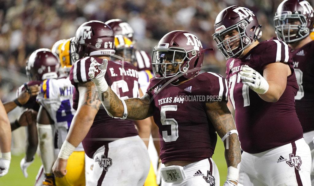 David J. Phillip Texas A&M's Trayveon Williams (5) celebrates after rushing for a touchdown against LSU during the first half of an NCAA college football game Saturday, Nov. 24, 2018, in College Station, Texas. (AP Photo/David J. Phillip)