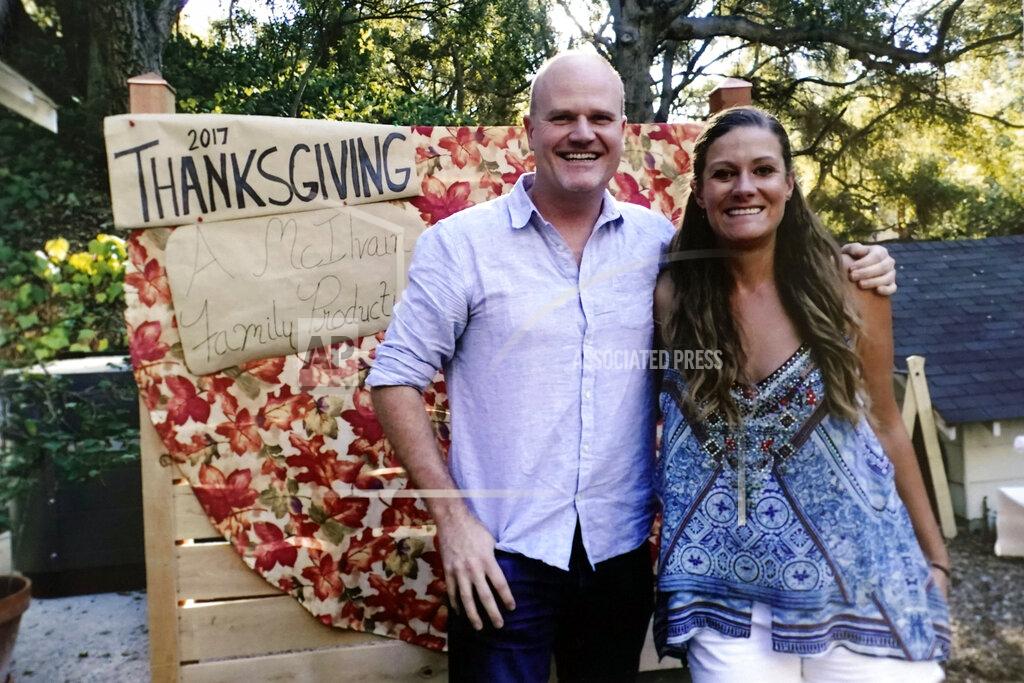 Uncredited In this November 2017 photo provided by Kathleen McIlvain, Charles McIlvain and his wife, Jasmine McIlvain pose at a family Thanksgiving gathering in Woodland Hills, Calif. Charles McIlvain was one of 34 people killed when dive boat Conception caught fire and sank off the coast of California on Sept. 2, 2019. (Kathleen McIlvain via AP)