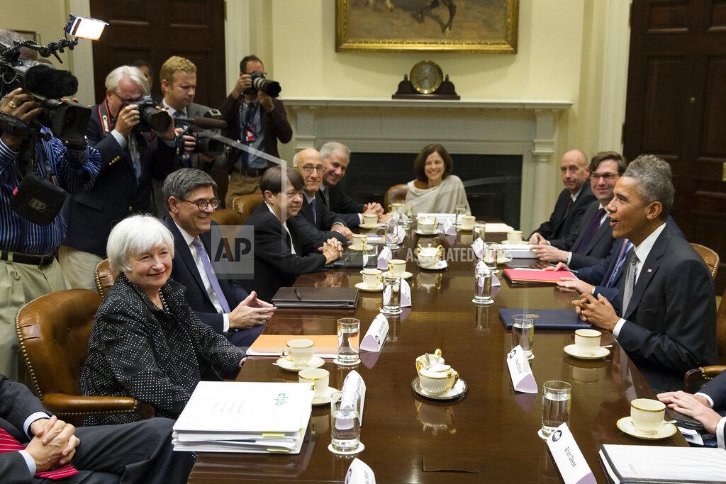 Evan Vucci FILE - In this Oct. 6, 2014, file photo President Barack Obama sits across the table from Federal Reserve Chair Janet Yellen, left, and Treasury Secretary Jacob Lew during a meeting with financial regulators in the Roosevelt Room of the White House in Washington. (AP Photo/Evan Vucci, File)