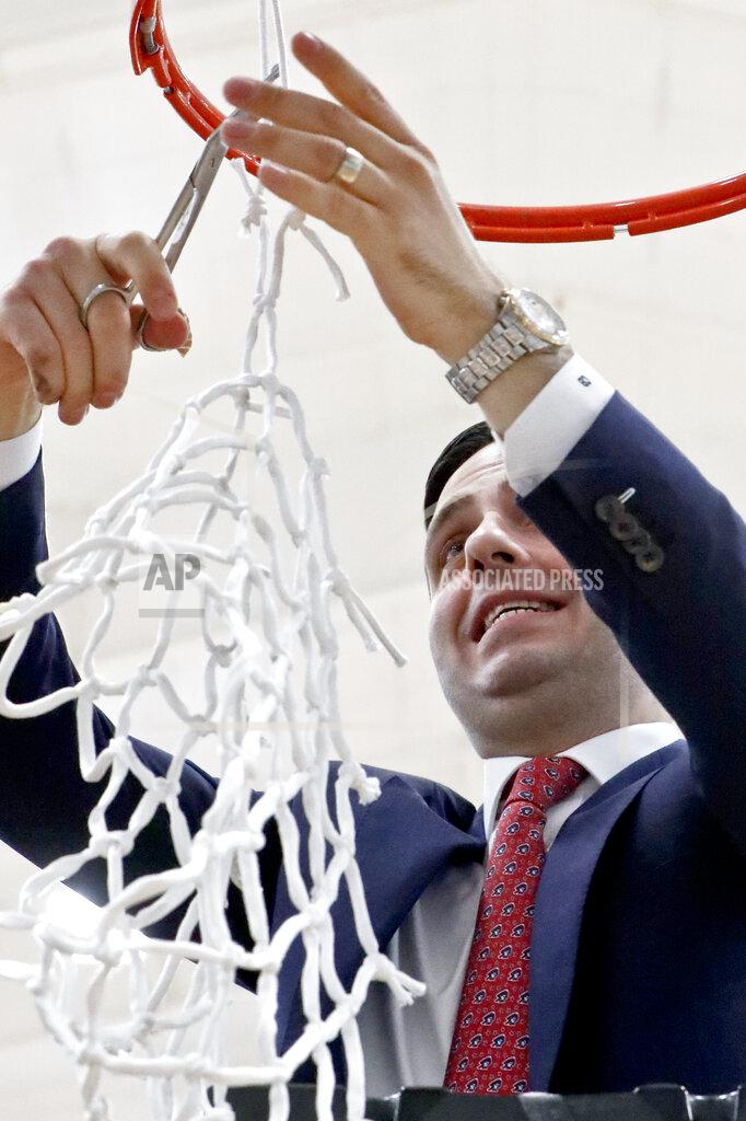 Keith Srakocic Robert Morris head coach Charlie Buscaglia, cuts down the net after defeating St. Francis (Pa) to win the NCAA college basketball game for the championship of the Northeast Conference women's tournament, Sunday, March 17, 2019, in Moon. Robert Morris won 65-54. (AP Photo/Keith Srakocic)