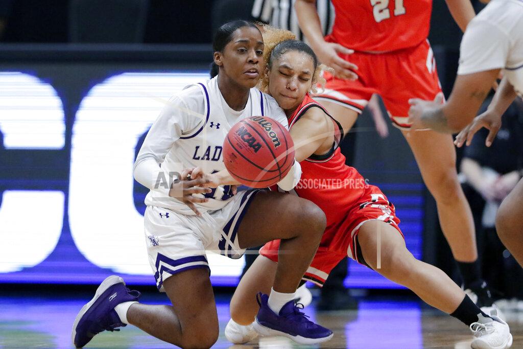 Michael Wyke Sam Houston State guard Faith Cook, right, knocks the ball away from Stephen F. Austin guard Brianna Mitchell (10) after a loose ball scramble during the second half of an NCAA college basketball game for the Southland Conference women's tournament championship Sunday, March 14, 2021, in Katy, Texas. (AP Photo/Michael Wyke)