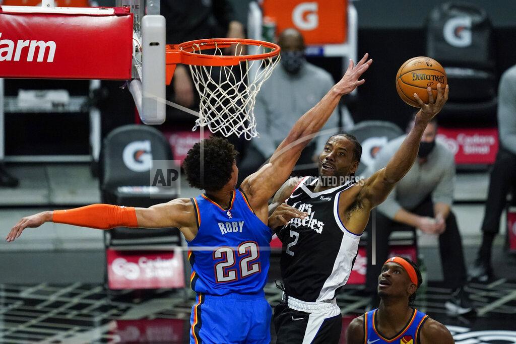 Ashley Landis Los Angeles Clippers forward Kawhi Leonard (2) takes a shot against Oklahoma City Thunder forward Isaiah Roby (22) during the first quarter of an NBA basketball game Sunday, Jan. 24, 2021, in Los Angeles. (AP Photo/Ashley Landis)