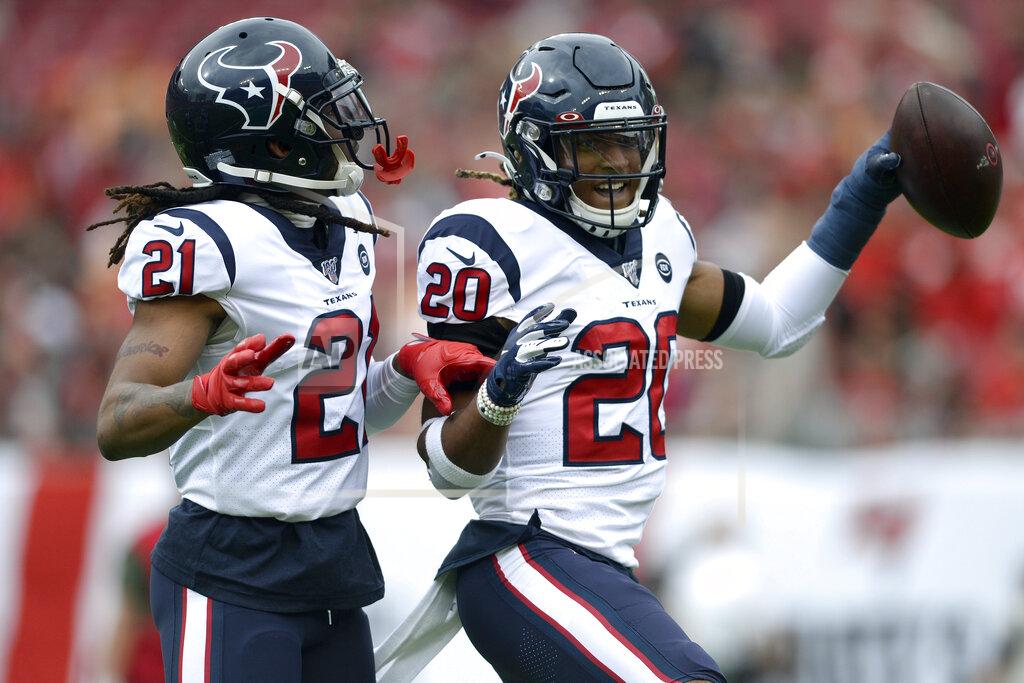 Jason Behnken Houston Texans strong safety Justin Reid (20) celebrates with cornerback Bradley Roby (21) after Reid intercepted a pass by Tampa Bay Buccaneers quarterback Jameis Winston during the first half of an NFL football game Saturday, Dec. 21, 2019, in Tampa, Fla. Roby also intercepted a pass by Winston. (AP Photo/Jason Behnken)
